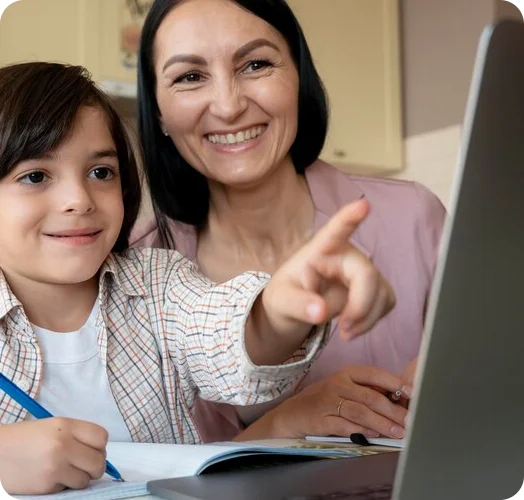 A student engages in learning activities with the support of their mother.